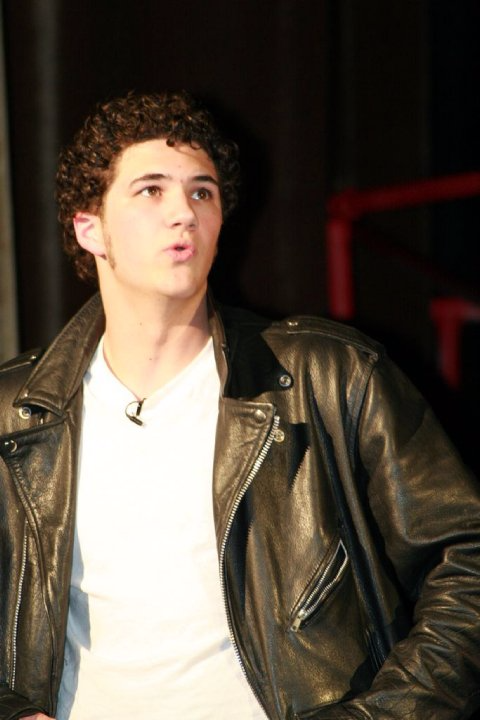 Carl singing in Grease