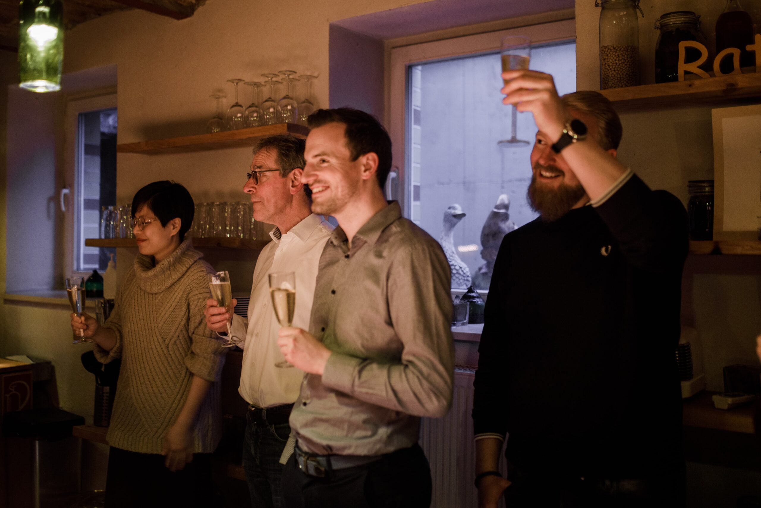 Office Workers in a bar raising glasses